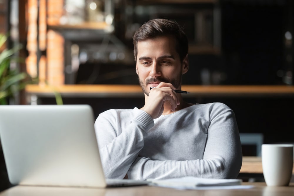 Thoughtful Businessman Looking At His Laptop