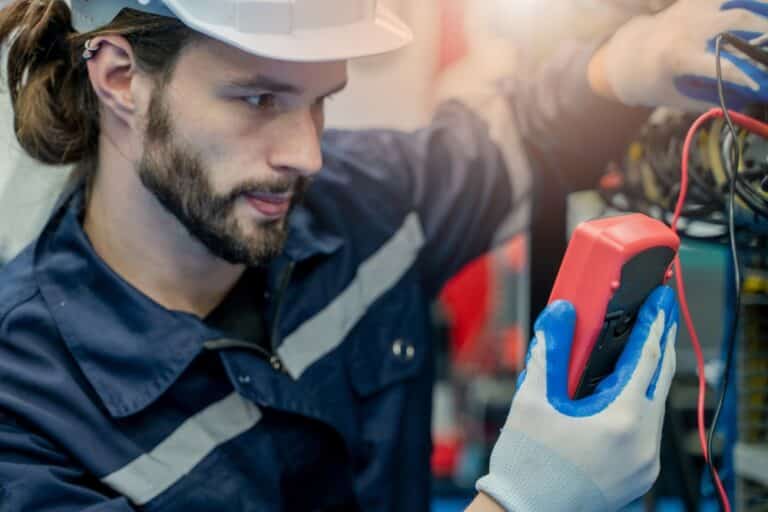 Electrical Engineers Using a Multimeter