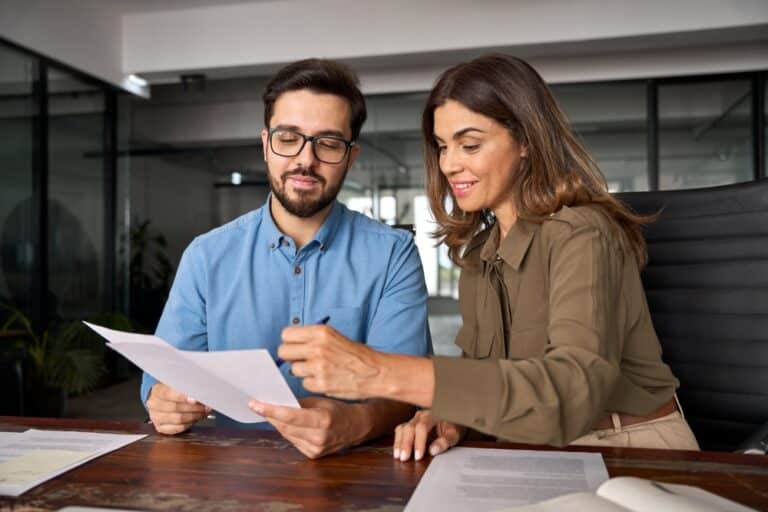 Professionals reviewing paperwork in an office